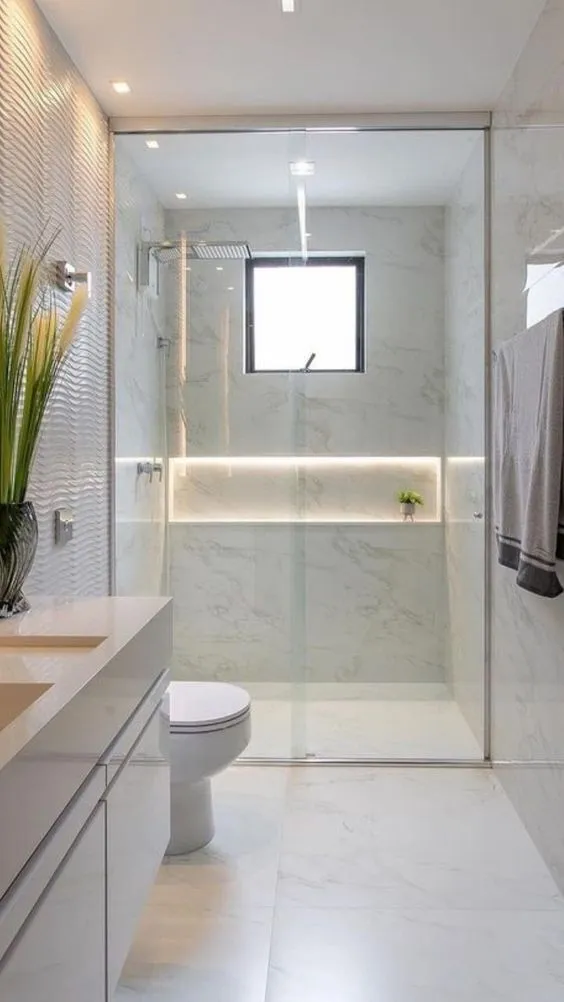 Renovasi rumah type 36 agar terlihat luas pada kamar mandi bisa dengan frameless standing shower